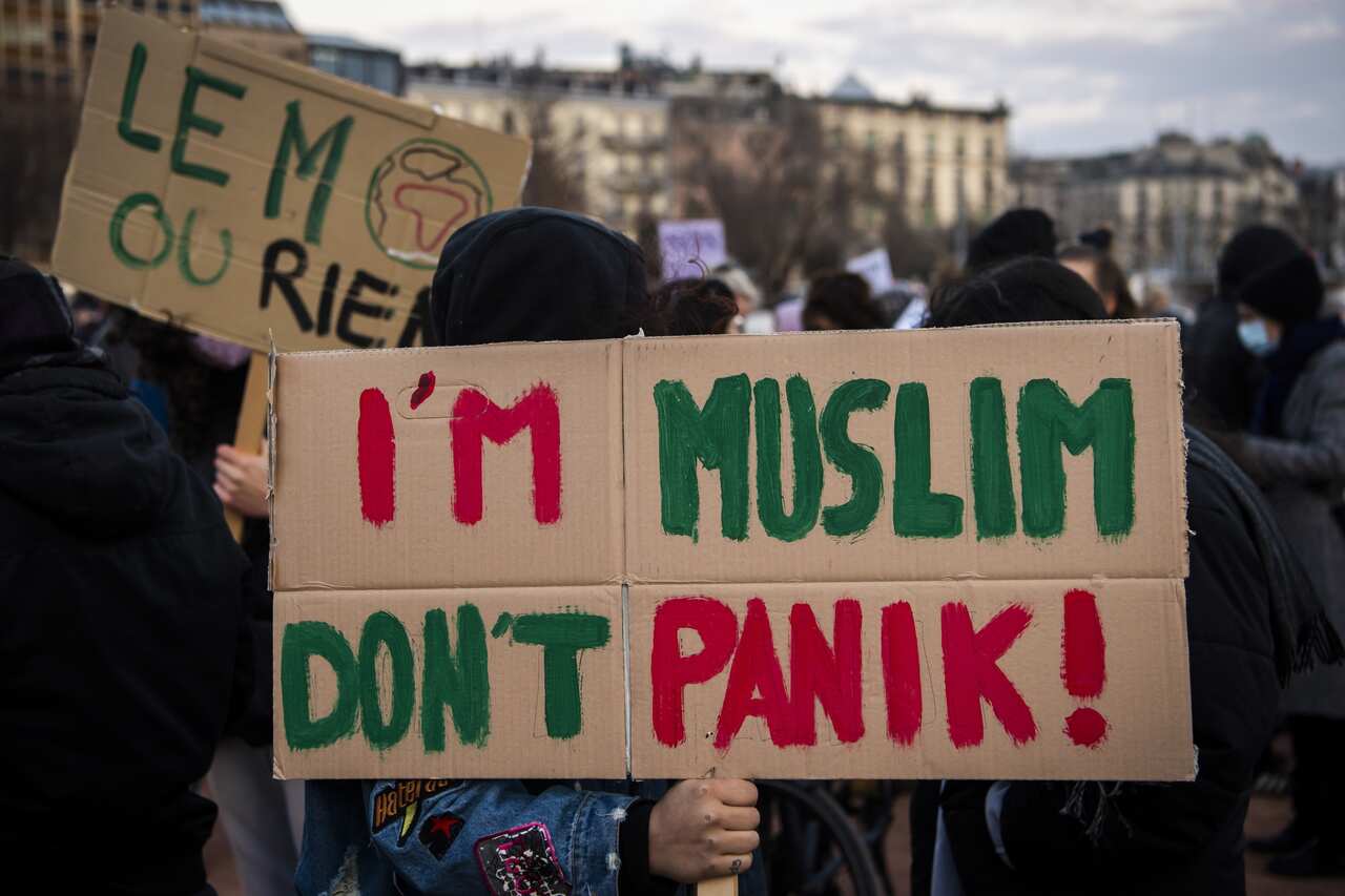 People from anti-racist and feminist associations demonstrate against the 'anti-burqa' initiative in Geneva, Switzerland.