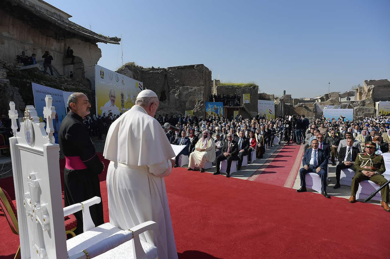 Pope Francis attends a ceremony at a square near the ruins of the Syriac Catholic Church of the Immaculate Conception