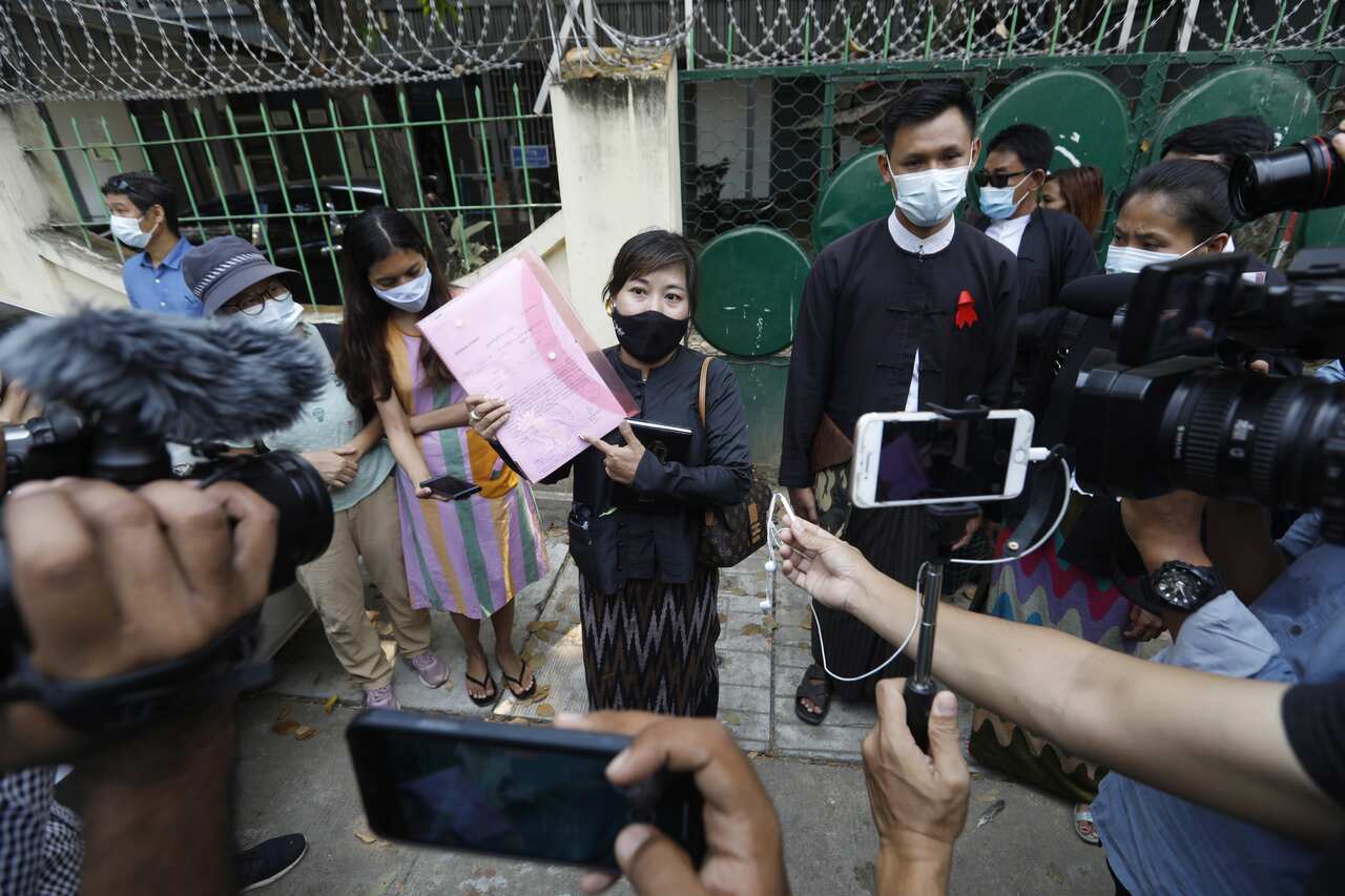 Tin Zar Oo, lawyer of  Associated Press photojournalist Thein Zaw, speaks to members of the media outside the Kamayut township court.