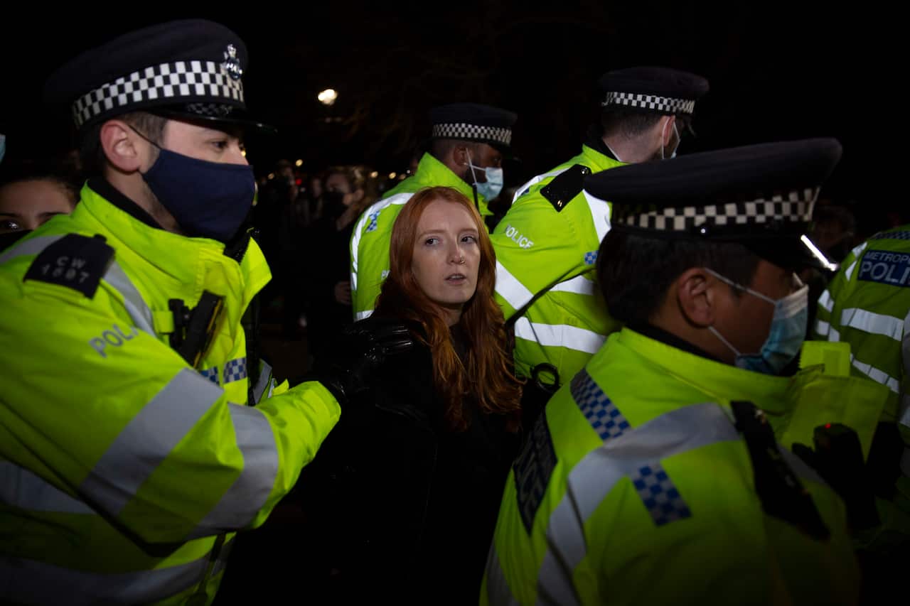 Patsy Stevenson is pictured being led by police during a vigil for Sarah Everard in Clapham Common, London.
