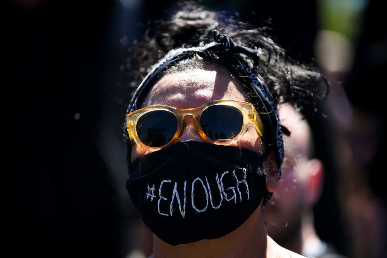 An attendee at the Women's March 4 Justice in Canberra in March.