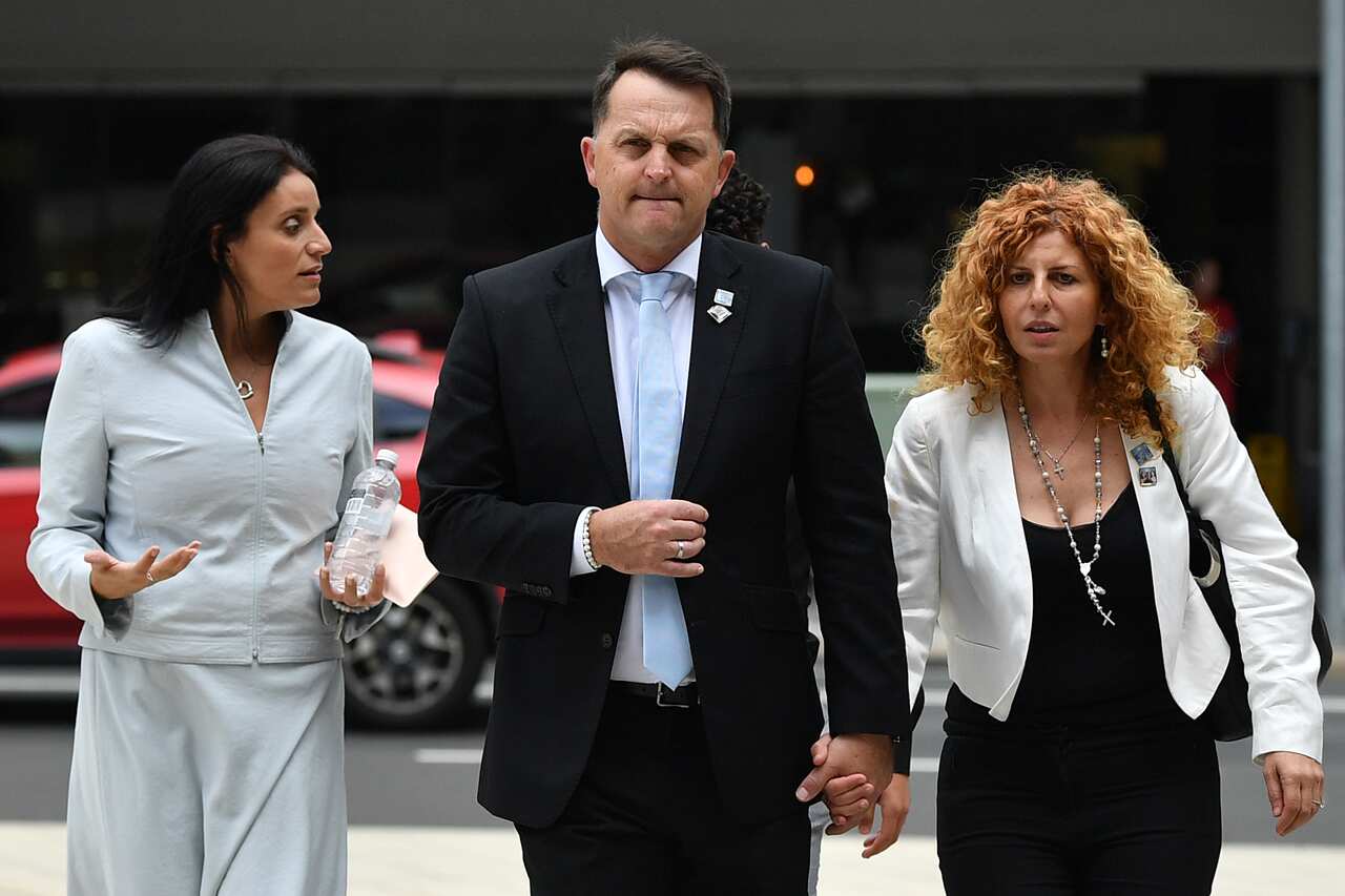 Bridget Sakr (right) and partner Craig Mackenzie (centre) return to Parramatta District Court in Sydney on Friday.