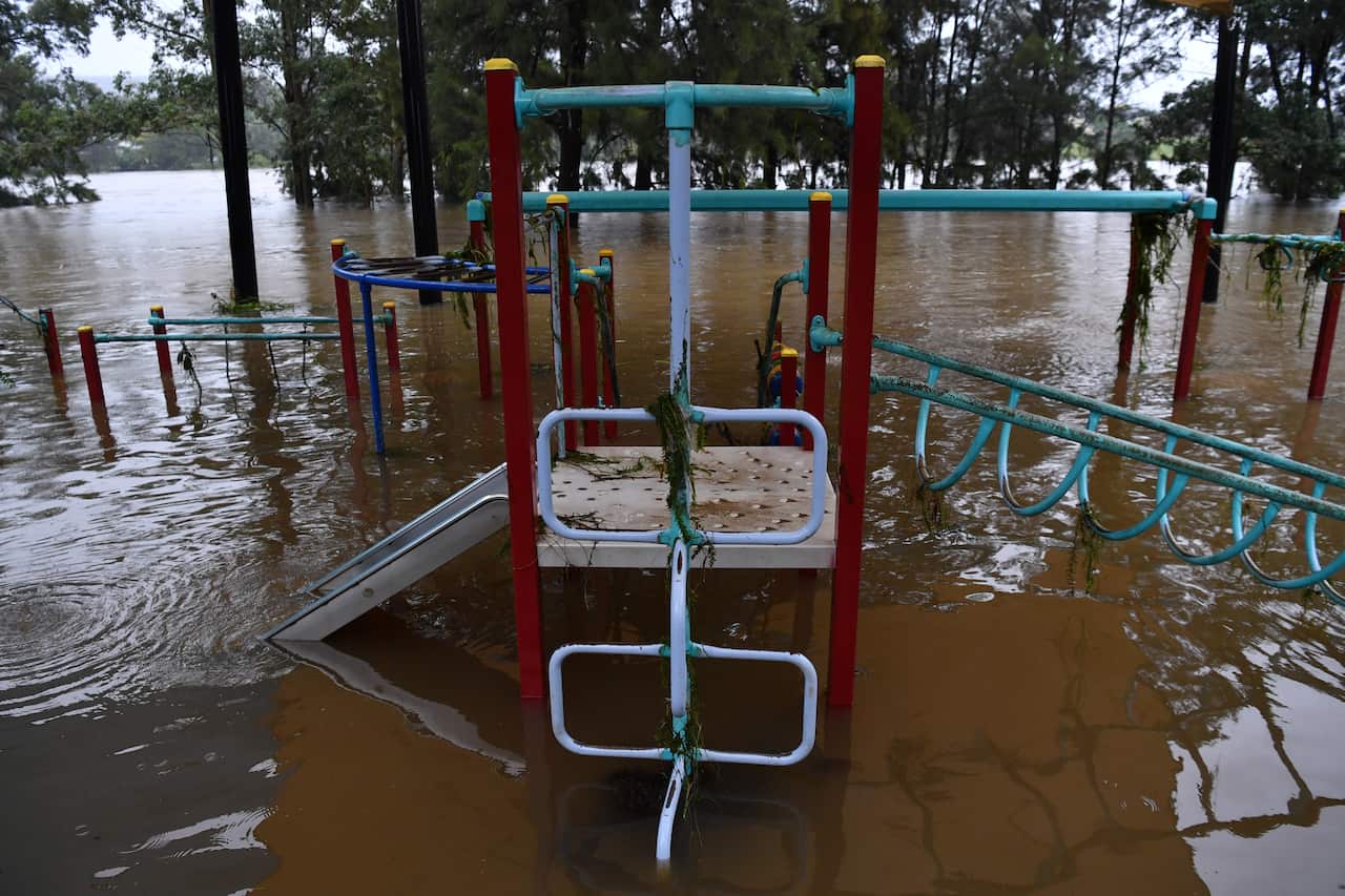 A semi-submerged playground on the banks of the flooded Nepean River at Trench Reserve at Penrith