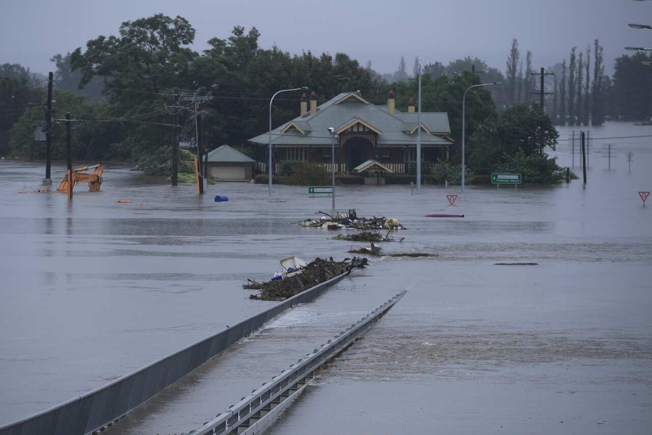 The New Windsor Bridge is seen inundated by flood waters from the Nepean River
