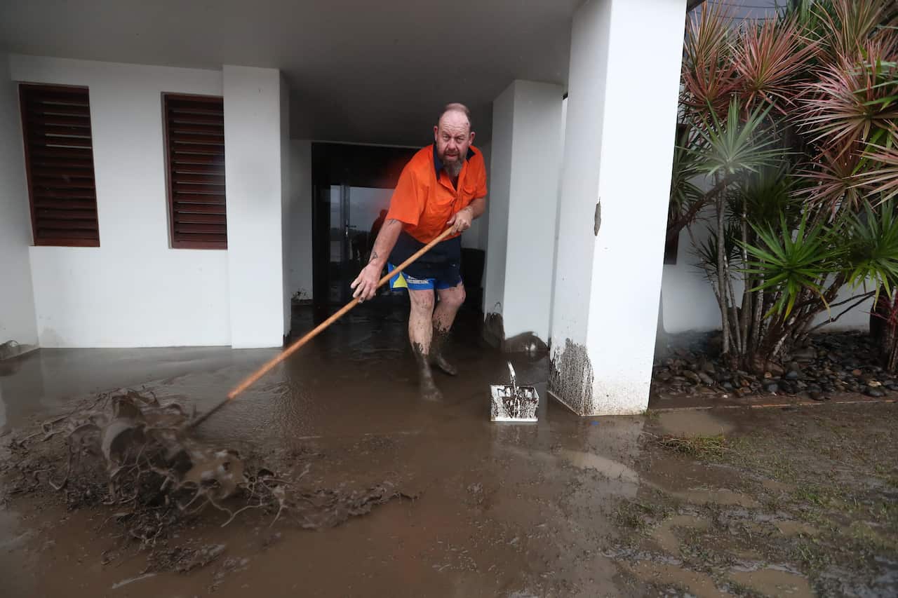 Residents begin cleaning up at Settlement Point in Port Macquarie, NSW, on 23 March, 2021. 