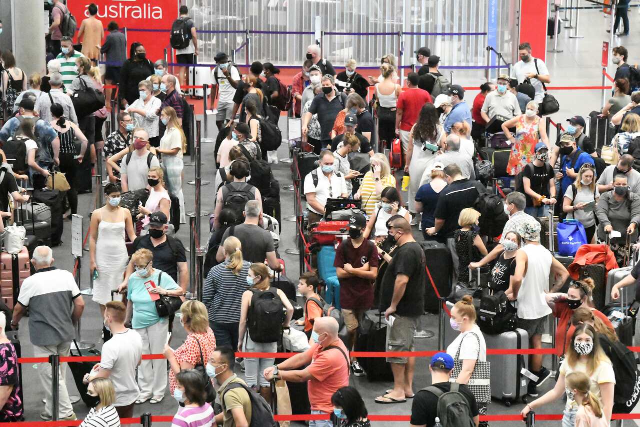 Passengers check in for flights out of  Brisbane, Monday, March 29, 2021. Greater Brisbane will enter a snap three-day lockdown as its coronavirus outbreak continues to grow.(AAP Image/Dave Hunt) NO ARCHIVING, EDITORIAL USE ONLY