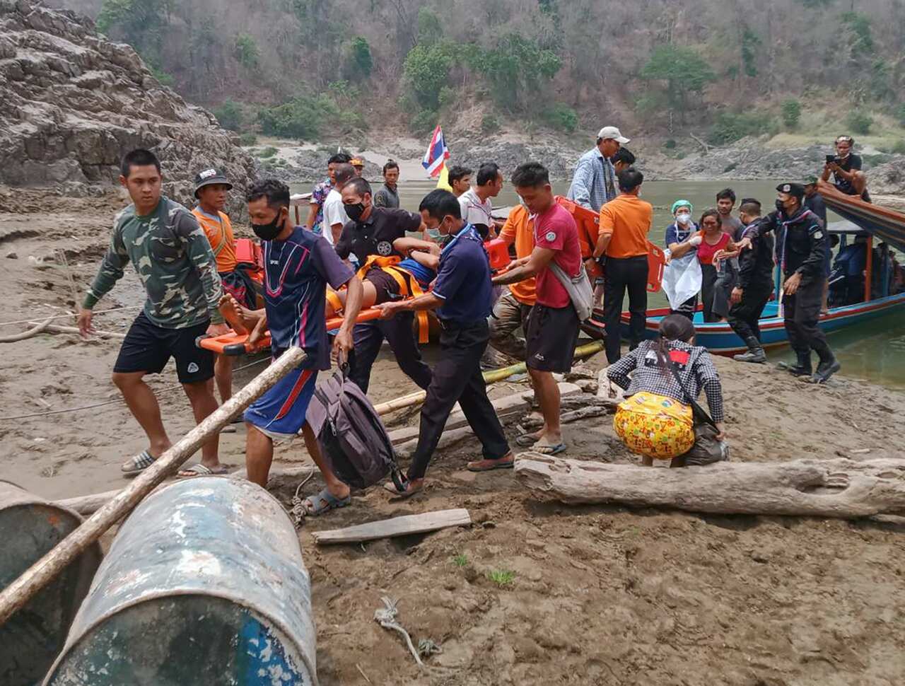 Injured Karen villagers arrive in Thailand after crossing the border on 30 March 2021. Thousands of villagers from Myanmar's Karen state fled for refuge.