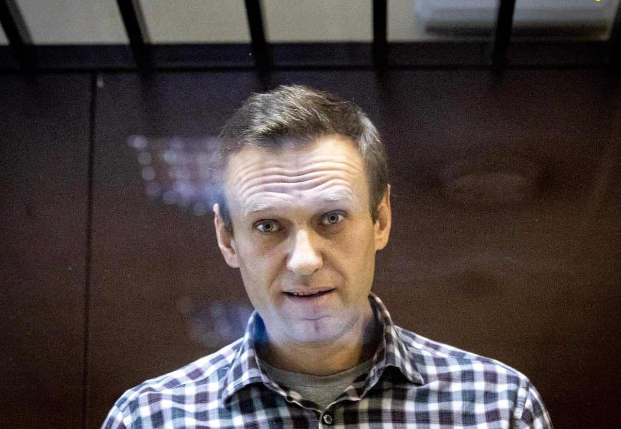 Alexei Navalny behind the glass of the cage in the Babuskinsky District Court in Moscow, Feb. 20, 2021.