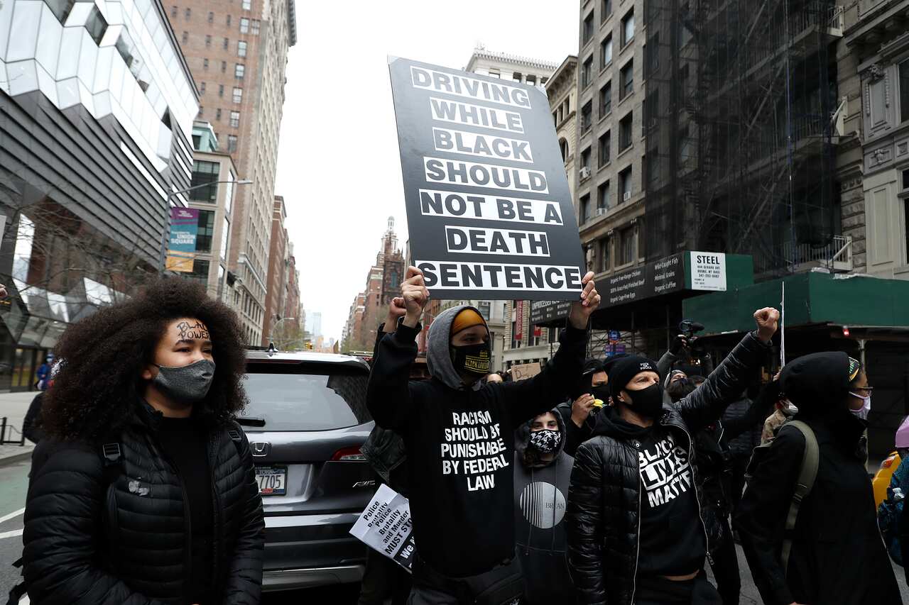Demonstrators rally through the streets from Washington Square Park in anger over the shooting of  Duante Wright in In Brooklyn Center Minnesota.