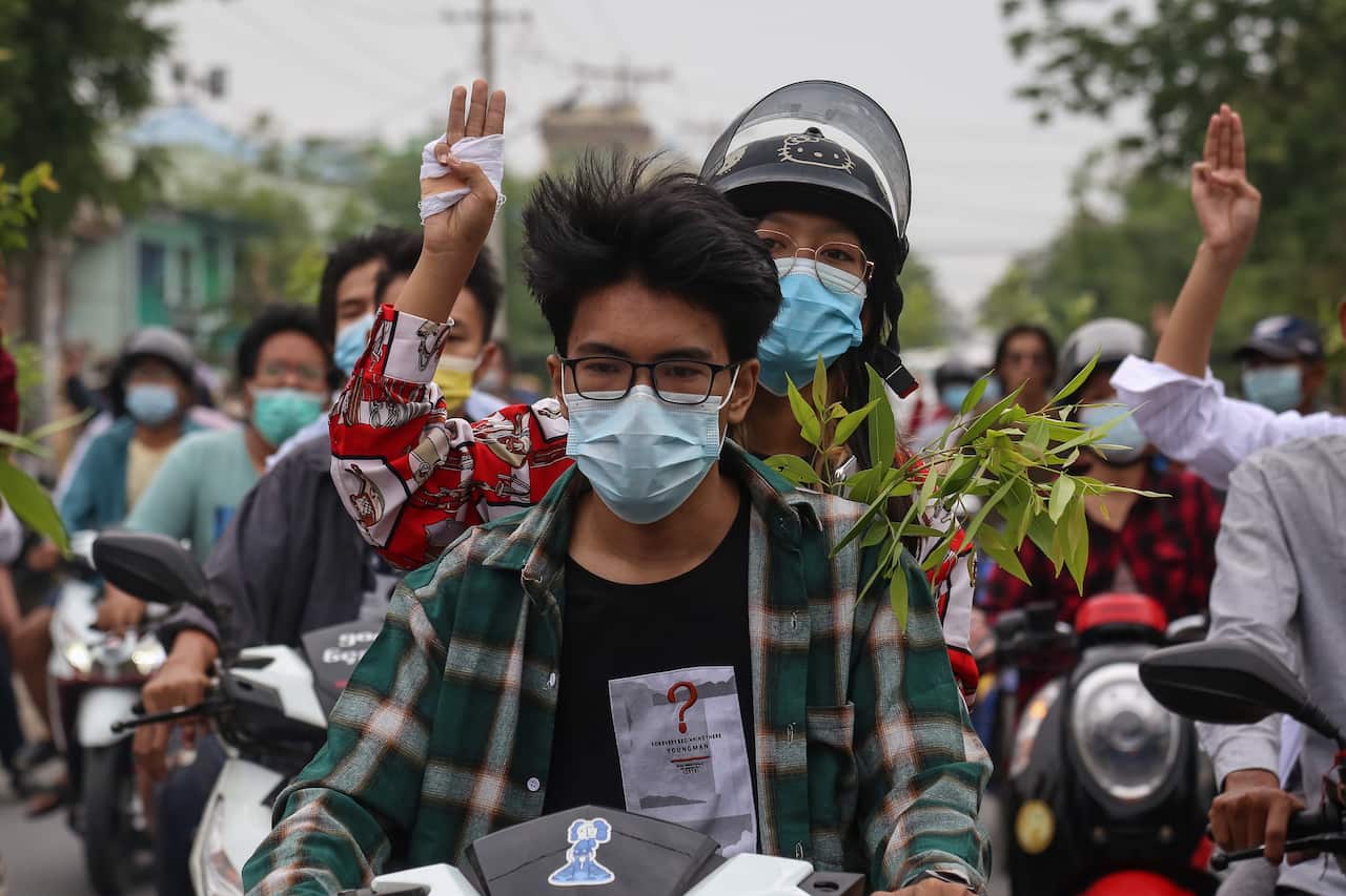 Demonstrators flash the three-finger salute during an anti-military coup protest in Mandalay, Myanmar, on 17 April, 2021. 