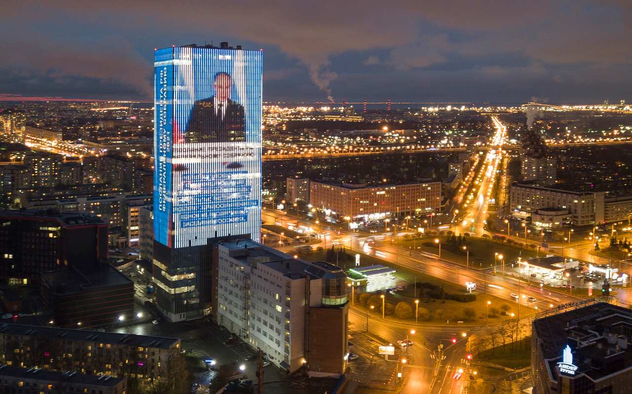 An image of Russian President Vladimir Putin speaking during his annual state of the nation address and a quote from his address in St Petersburg, Russia.
