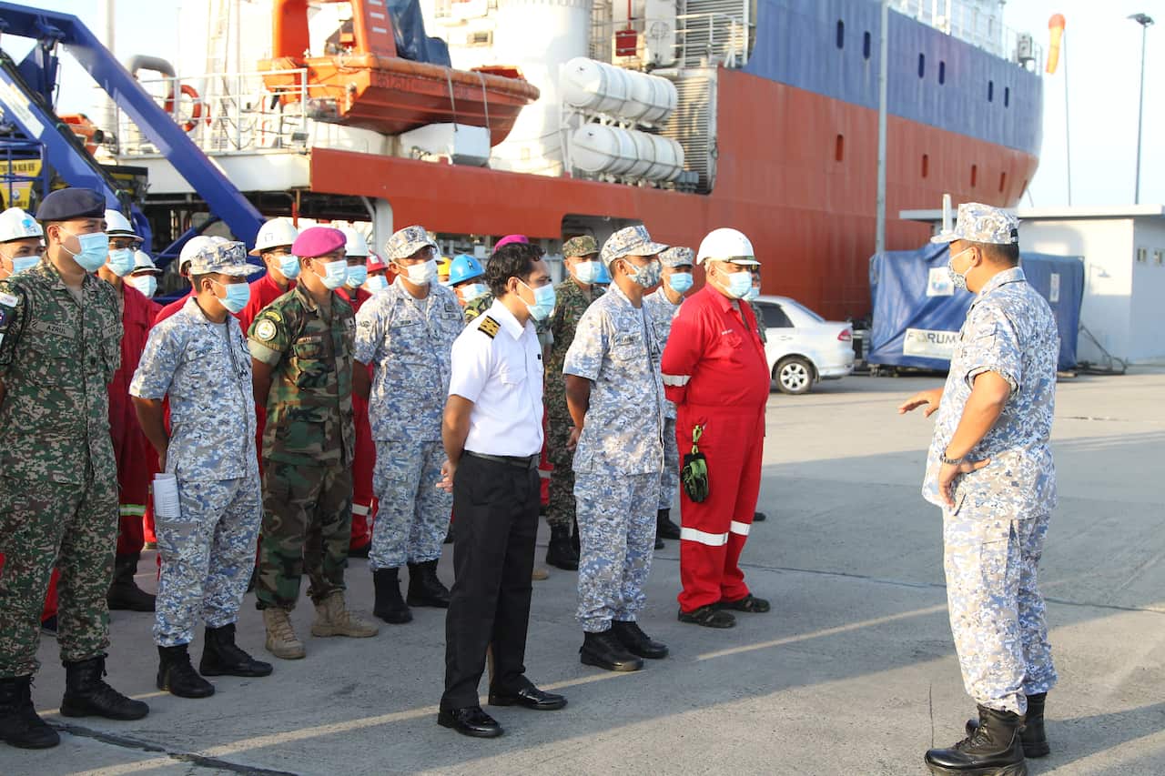 Members of the Royal Malaysian Navy prepare to join the search for missing Indonesian submarine KRI Nanggala at Sepanggar navy base, Malaysia.