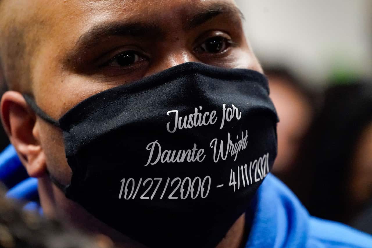 A mourner wears a mask  Daunte Wright during his funeral service at Shiloh Temple International Ministries in Minneapolis