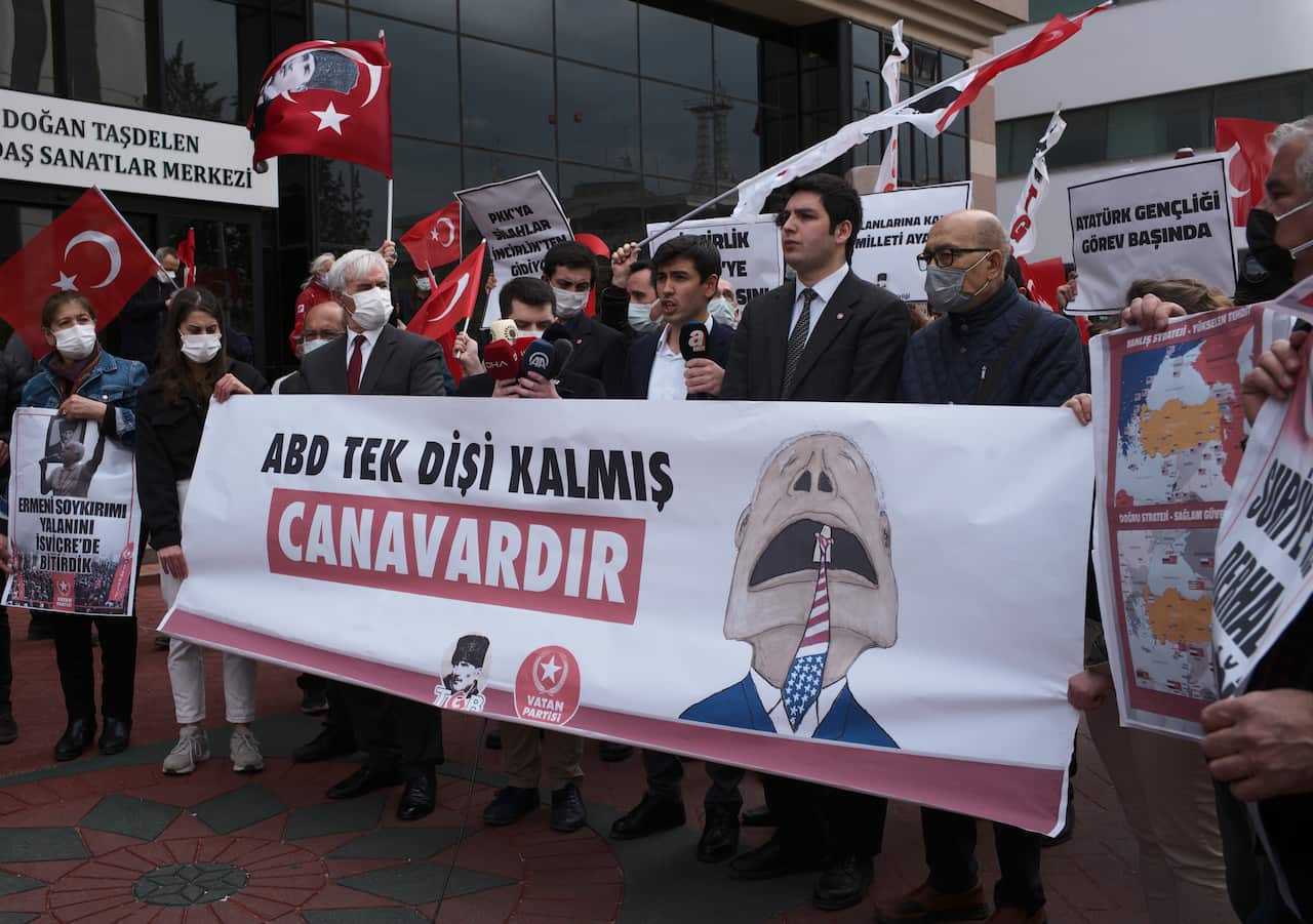 Protesters hold a banner that reads "USA is a single-fanged monster", referring to a verse describing western nations in the Turkish National Anthem