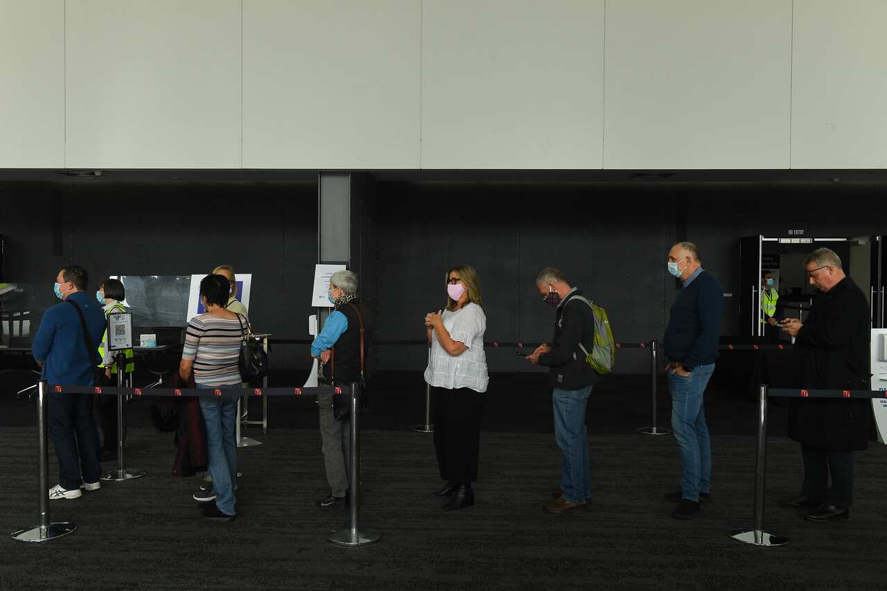 People wait in line for a vaccine in Melbourne on 3 May. 