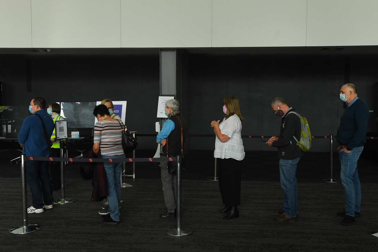 People lining up to get their COVID-19 vaccine at the Melbourne Convention and Exhibition Centre on Monday, 3 May, 2021.