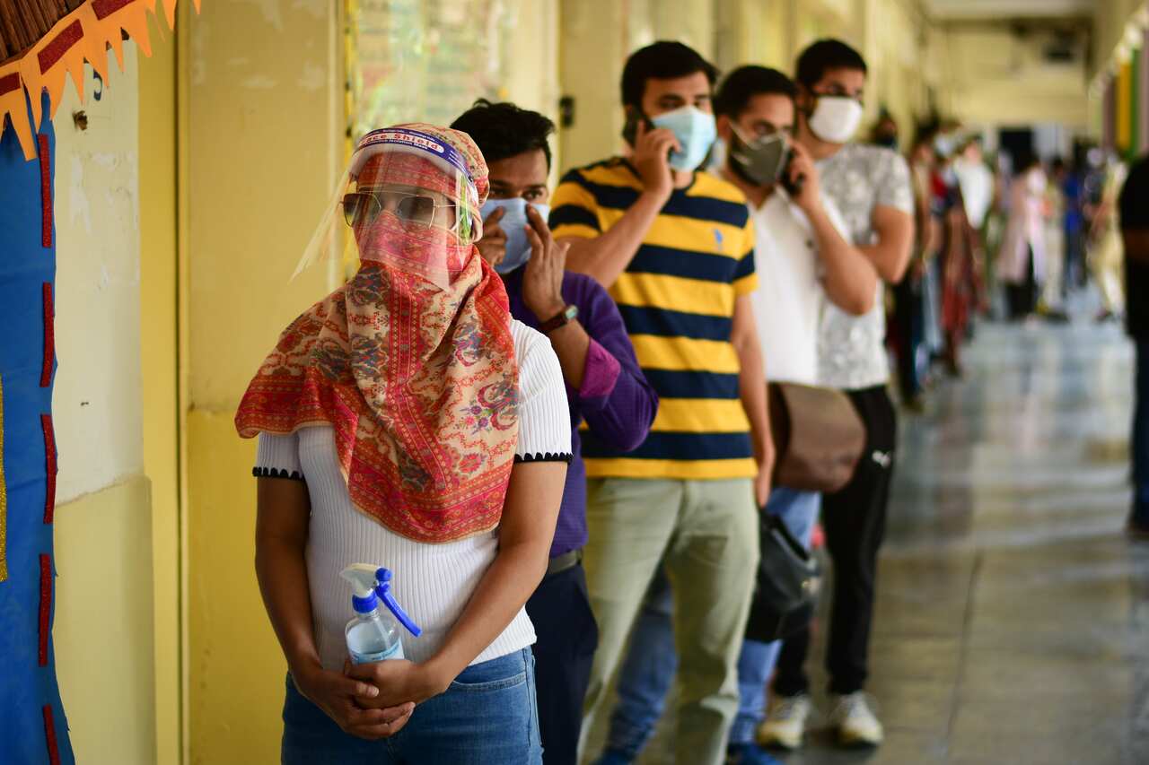 People line up to receive their first dose of covishield vaccine at Navyug school pandara park.Phase 3 Of Covid-19 Vaccination Starts In India. The Delhi administration has decided to set up vaccination centres at 77 government schools as the national cap