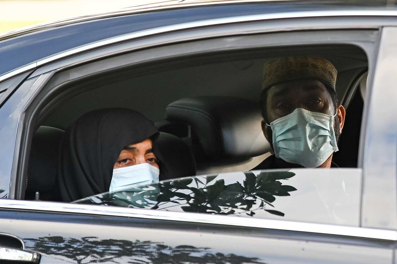 The parents of Ayaz Younus watch from a car as he is buried at the Riverstone Cemetery at Marsden Park, NSW, Wednesday, May 5, 2021. Pakistani national Ayaz Younus,  died in floodwaters in Glenorie NSW in March. (AAP Image/Steven Saphore) NO ARCHIVING