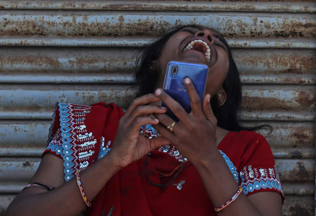 A woman mourns as her relative died of Covid-19 coronavirus at the Covid-19 hospital in Ahmedabad, India, 07 May 2021. According to the Indian Ministry of Health, India recorded 414,000 fresh Covid-19 cases in the last 24 hours.  EPA/DIVYAKANT SOLANKI