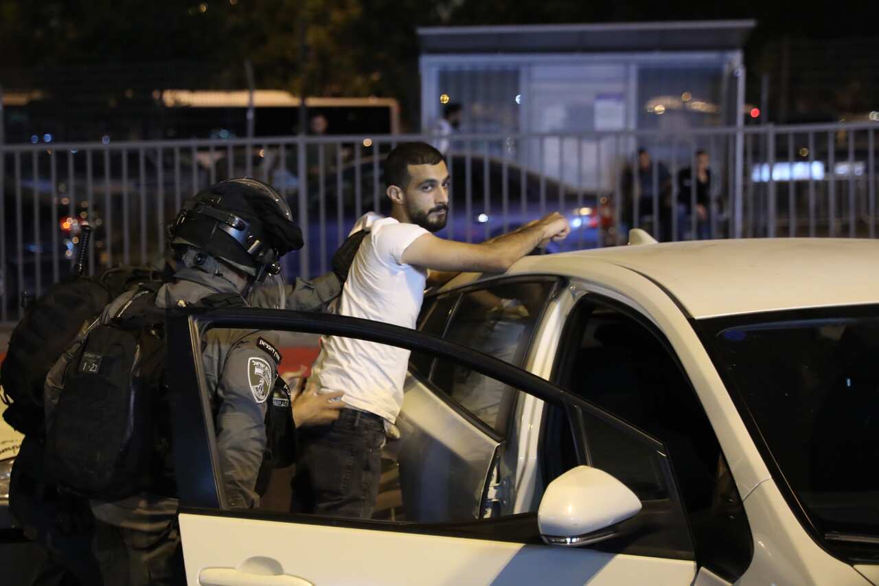 Israeli border police frisks a Palestinian during a protest supporting Palestinians families that face eviction from their homes at Sheikh Jarrah neighborhood in Damascus gate in Jerusalem, 07 May 2021.