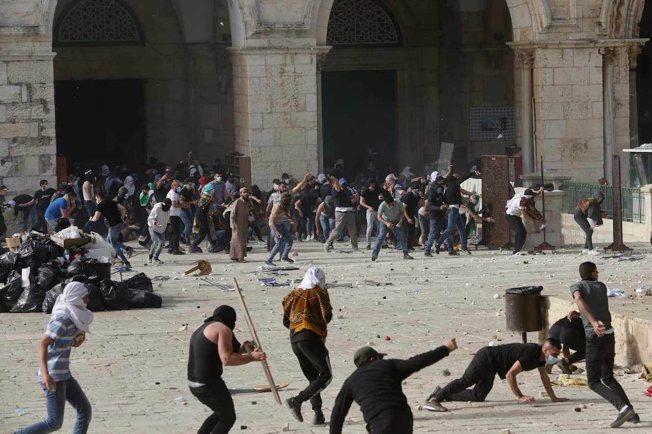 Palestinians clash with Israeli security forces at the Al Aqsa Mosque compound in Jerusalem's Old City Monday, 10 May, 2021. 