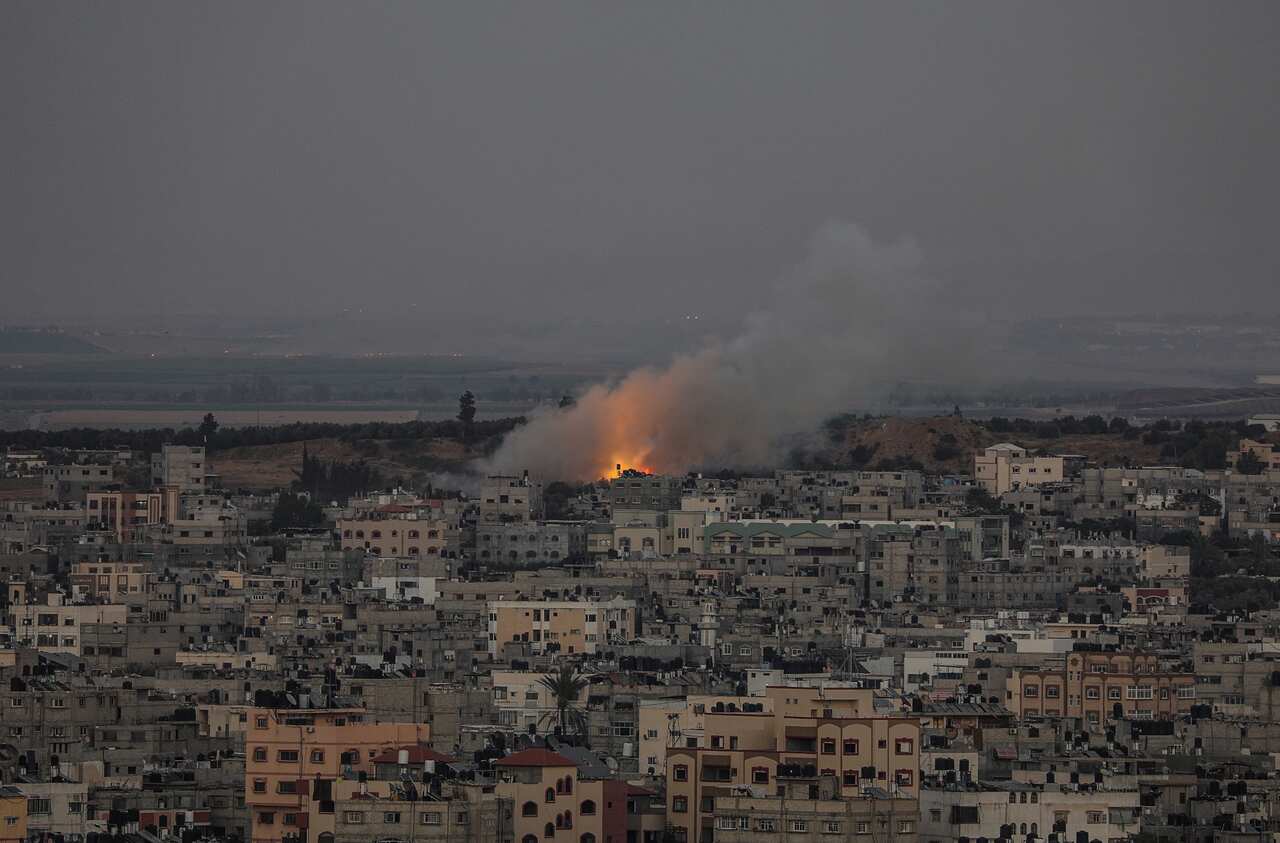 Smoke rises after an Israeli strike in Al Shejaeiya neighbourhood in the east of Gaza City, on 13 May 2021. 