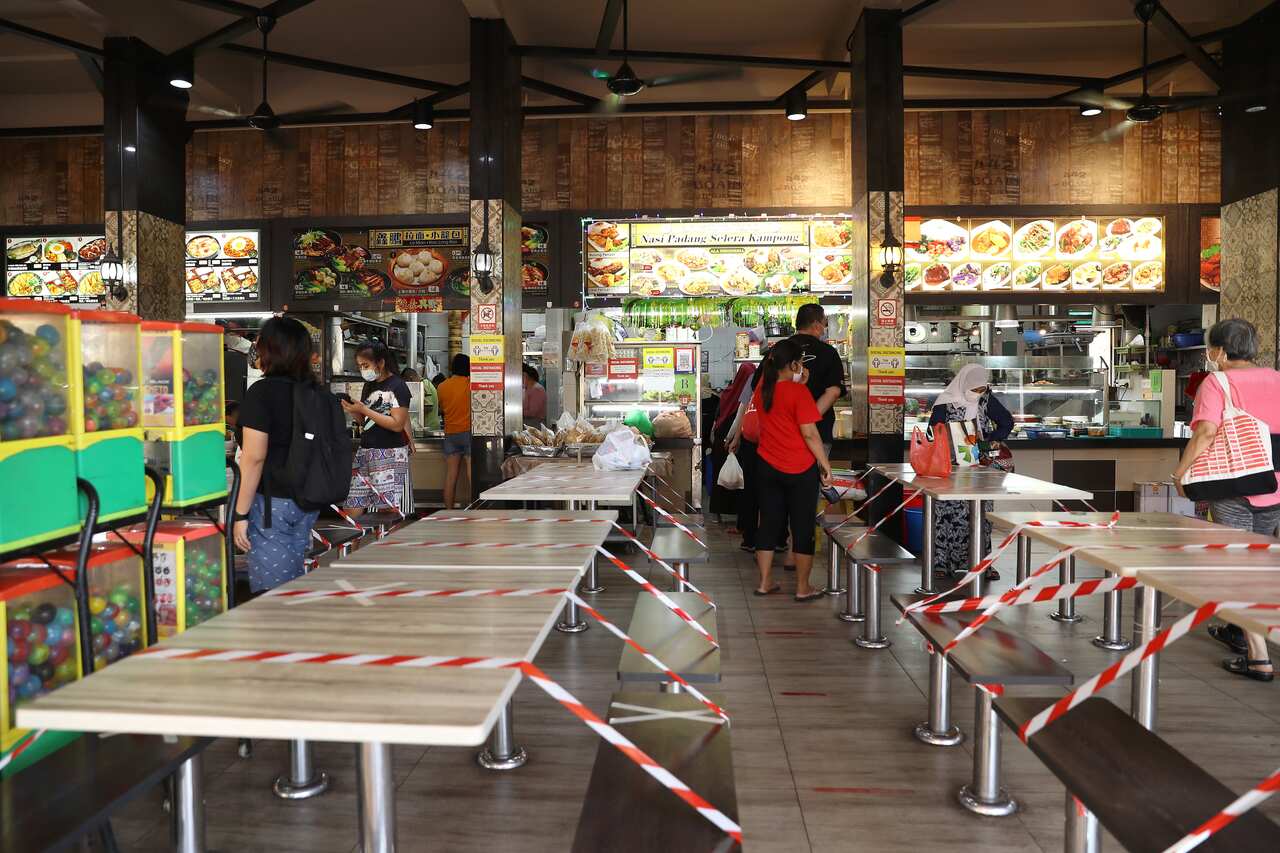 Tables at a Singapore food court are cordoned off as no dining-in is allowed during the recent COVID-19 outbreak.