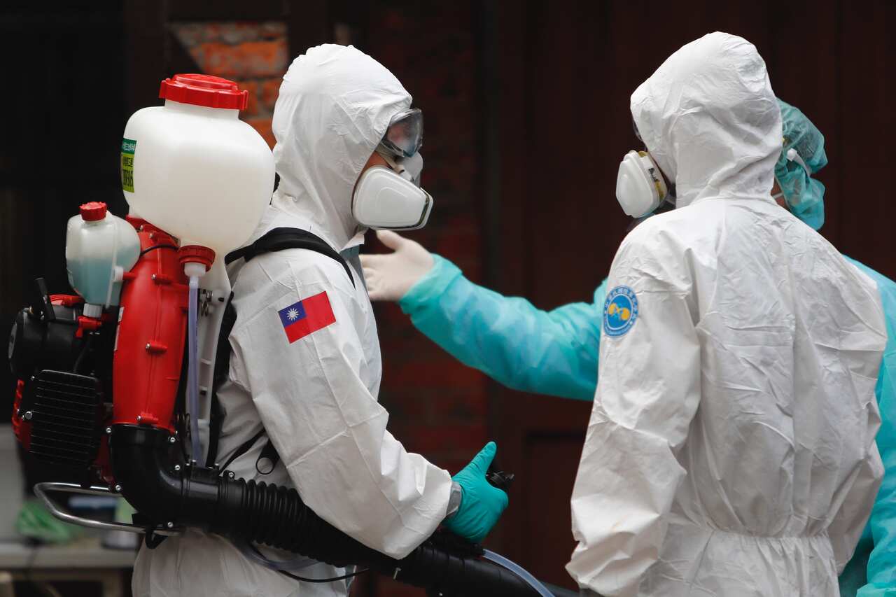 Military officers sanitise COVID-19 testing centers and workers as Taiwan raised its coronavirus alert levels. Taipei, Taiwan, 16 May 2021.