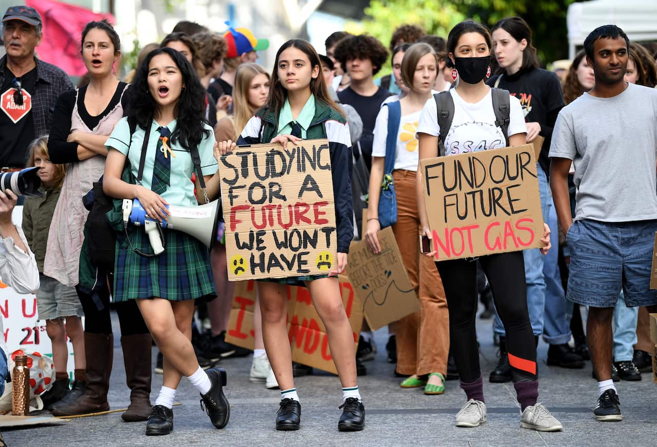 School students hold signs during School Strike 4 Life protest, in Brisbane, Friday, May 21, 2021.