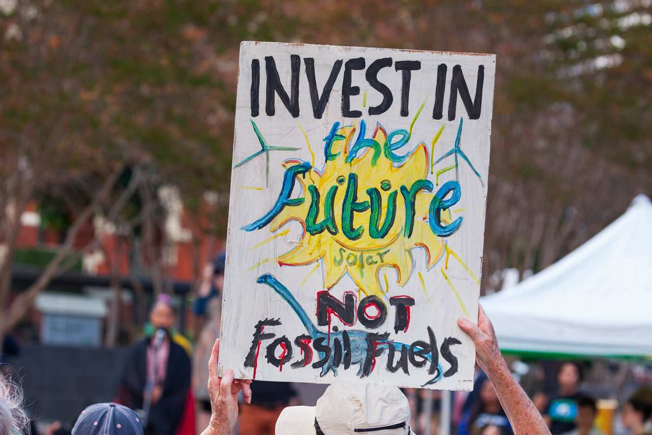 A protester holds a placard during a School Strike 4 Climate event in Australia.