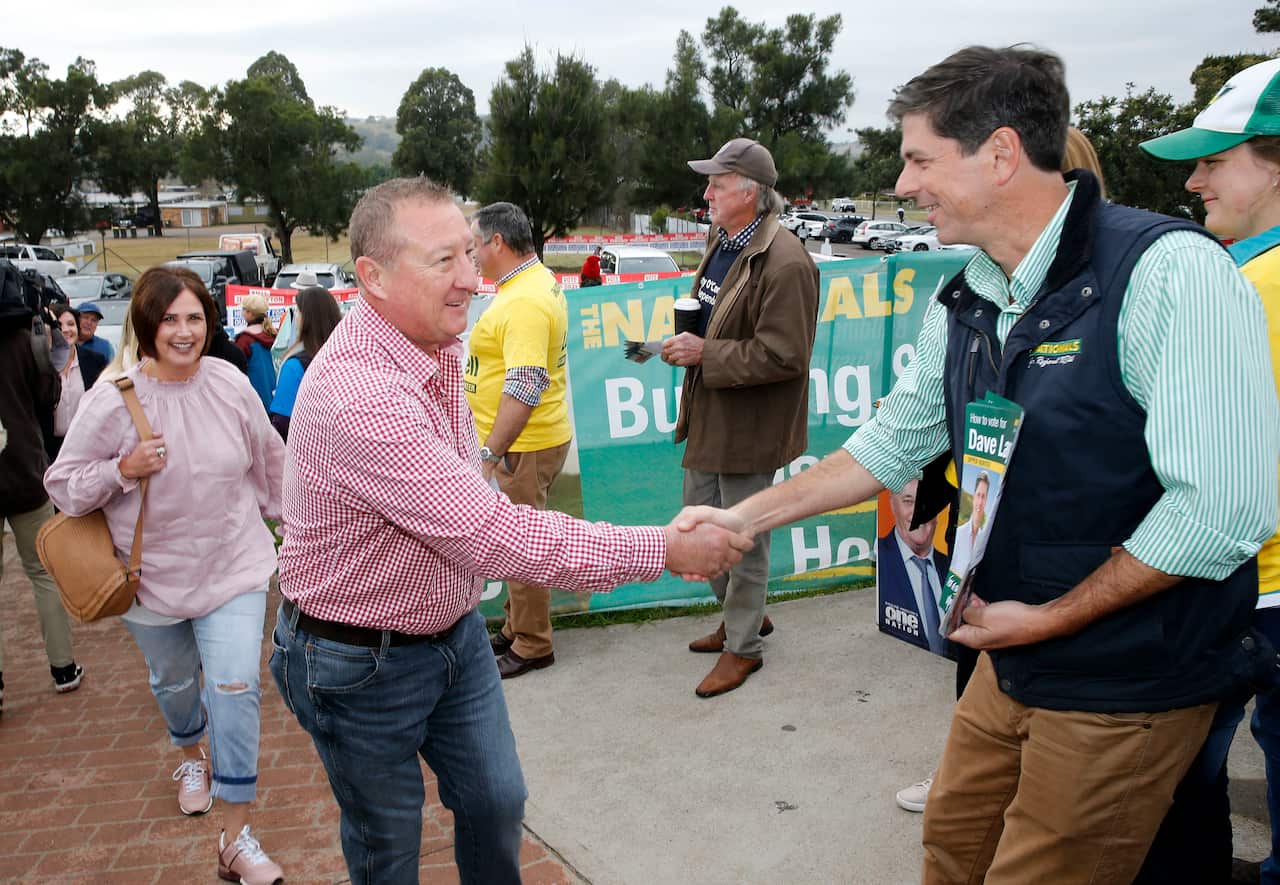 Labor candidate for Upper Hunter Jeff Drayton greets Nationals candidate for Upper Hunter Dave Layzell. 