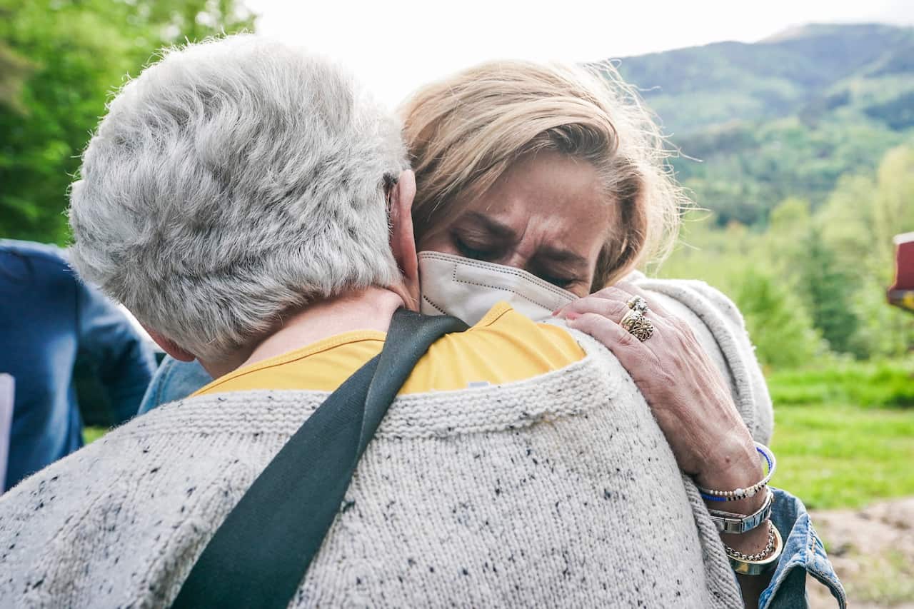 The Mayor of Stresa Marcella Severino (right) reacts in the area where a cable car crashed in Mottarone Stresa, near Turin, Italy on 23 May 2021.