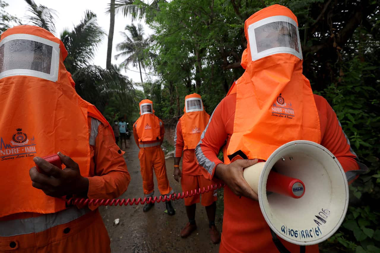National Disaster Response Force members urged villagers to evacuate the area before Cyclone Yaas made landfall, in Kolkata India, 25 May 2021.