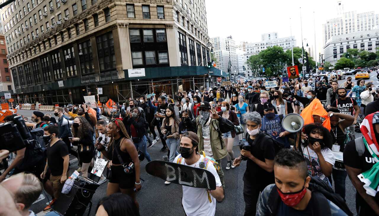 Demonstrators march towards the Brooklyn Bridge