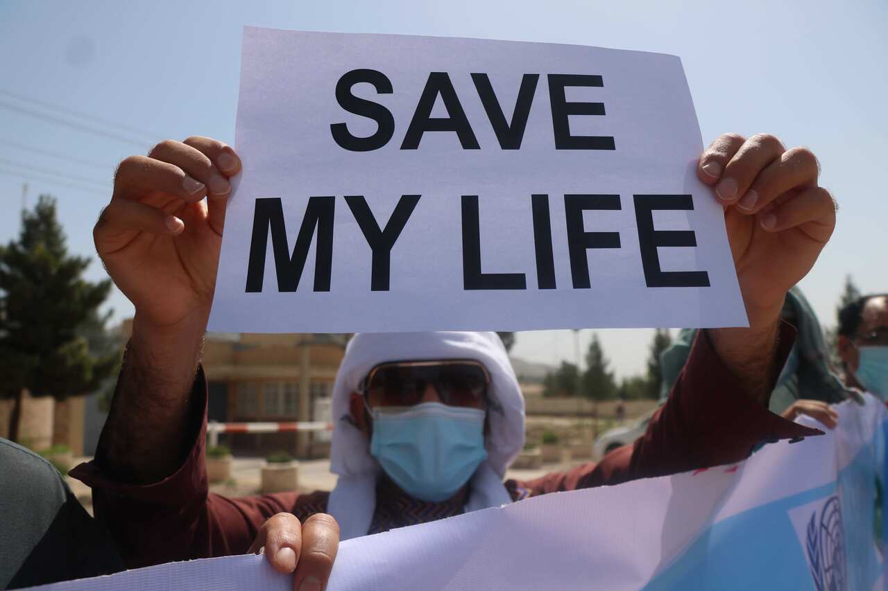 There are 100 former interpreters and staff of Australia's mission in Afghanistan still waiting for their visas to be processed