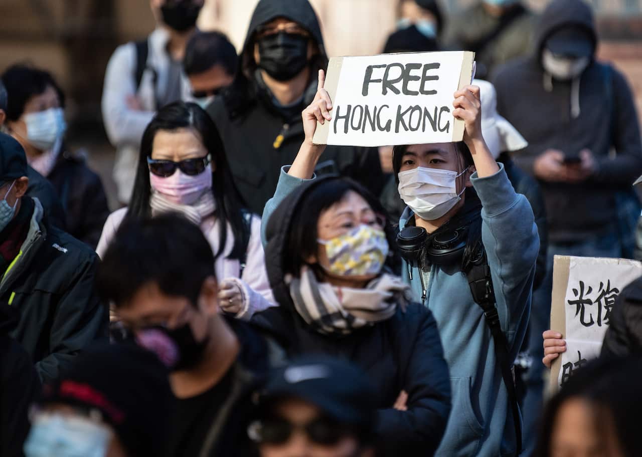 Protestors listen to speakers during a rally to show support to for people in Hong Kong. 