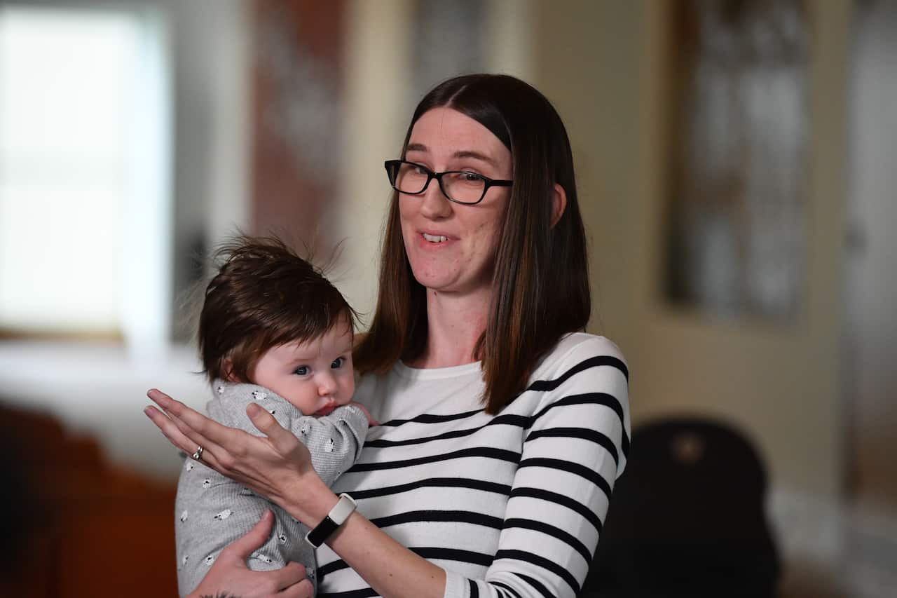 Sophie Robinson and Lucy, 4 months, at a press conference at Parliament House in Canberra, Tuesday, June 15, 2021.