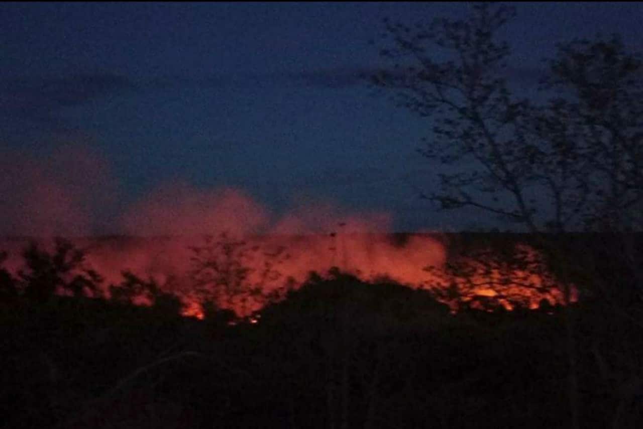 Flame rises from burning houses in Kinma village, Pauk township, Magwe division, central Myanmar, Tuesday June 15, 2021. Residents said people are missing after military troops burned the village. (AP Photo)
