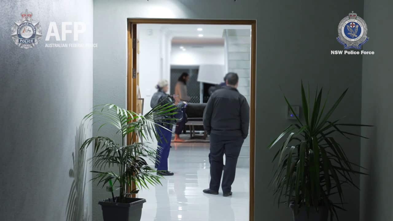 A supplied imaged obtained on Saturday, 19 June, 2021, shows the arrest of a 24-year-old Sydney man following raids in Chester Hill and Sefton