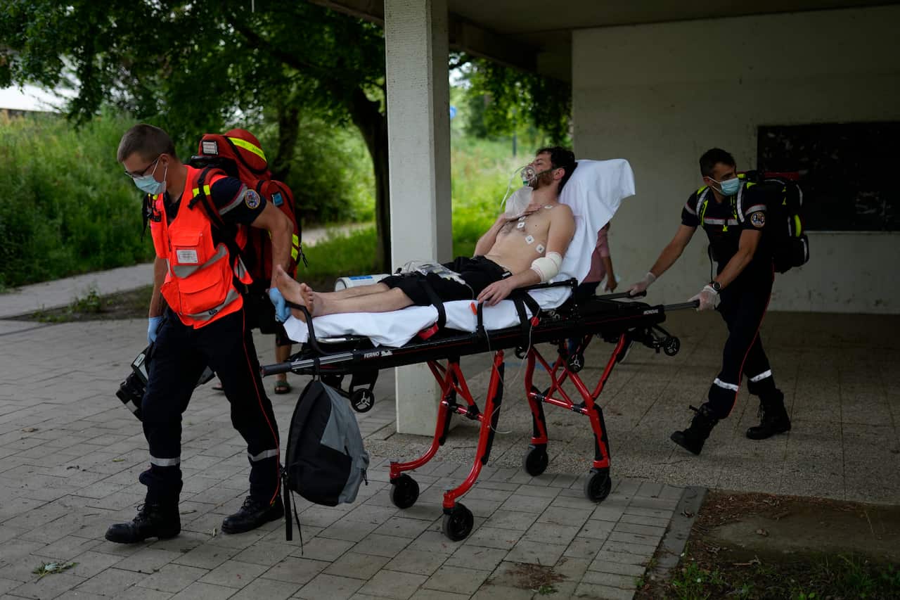 A man on hunger strike is transferred to a hospital as he occupies with others a big room of the ULB Francophone university in Brussels, Tuesday, June 29, 2021