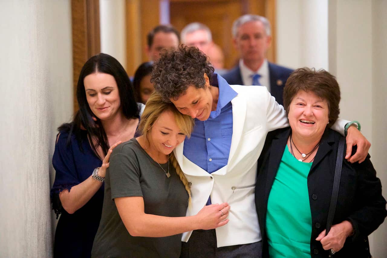 Andrea Constand (C) reacts after the guilty verdict on April 26, 2018