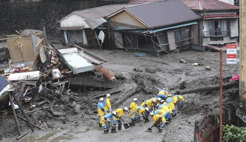 Police officers conduct a research in Atami, Shizuoka Prefecture on 4 July 2021.