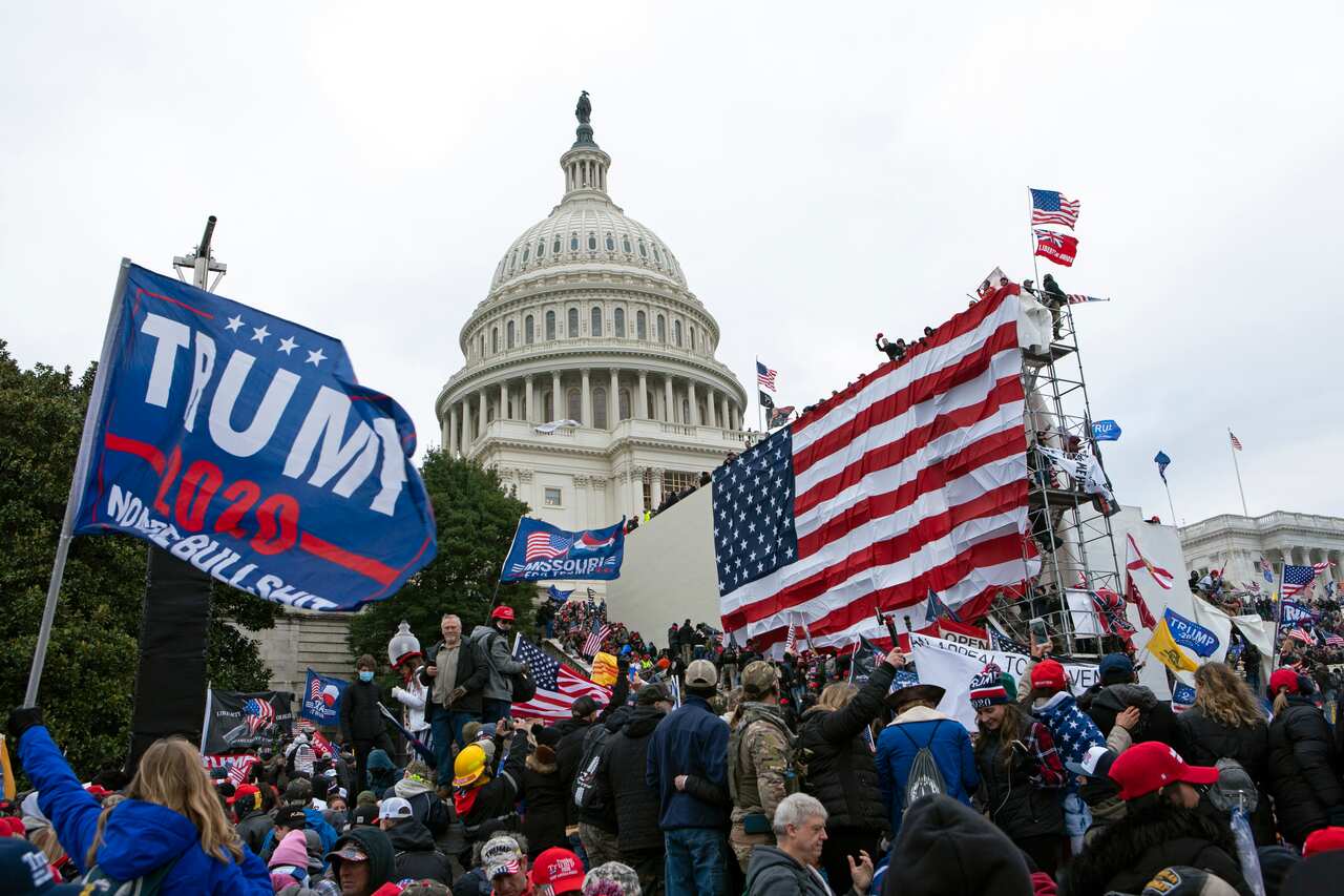 Rioters loyal to then-President Donald Trump outside of the US Capitol on 6 January 2021