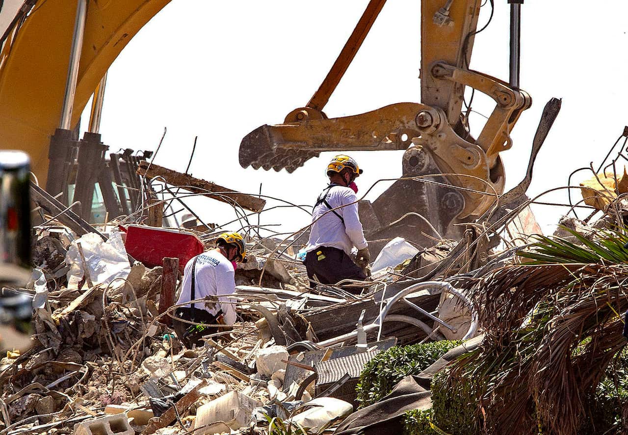Rescuers in the rubbles of the Champlain Towers South collapse