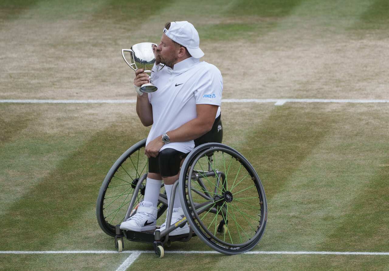 Dylan Alcott with the winners trophy after winning the final of the quad wheelchair singles