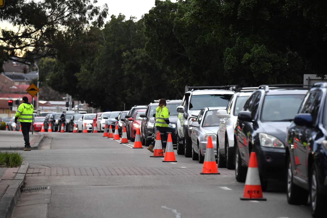 Long queues of cars are seen at a pop up Covid testing clinic at the Fairfield Showgrounds in Sydney on Wednesday morning.