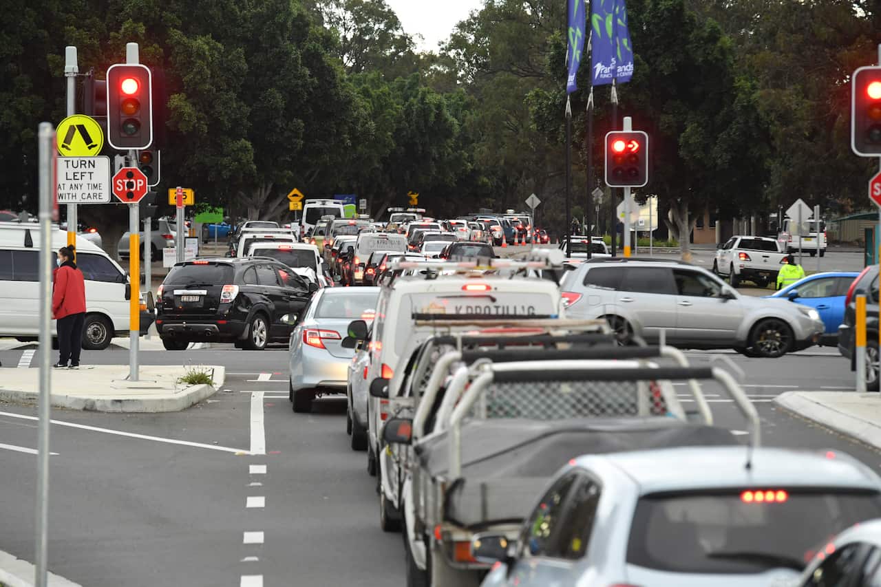 Long queues of cars are seen at a popup COVID testing clinic at the Fairfield Showgrounds in Sydney, Wednesday, July 14, 2021.