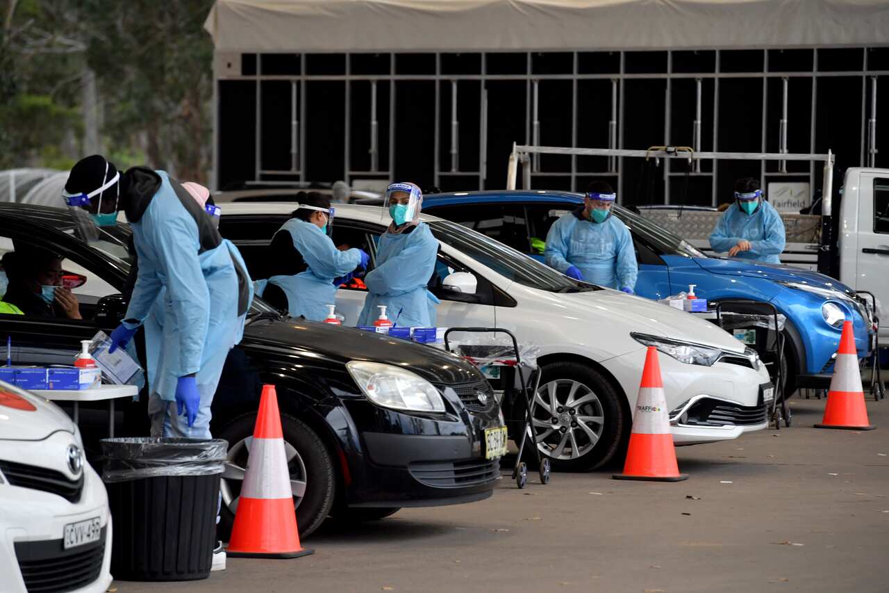Members of the public and health workers at a pop up Covid testing clinic at the Fairfield Showgrounds in Sydney.