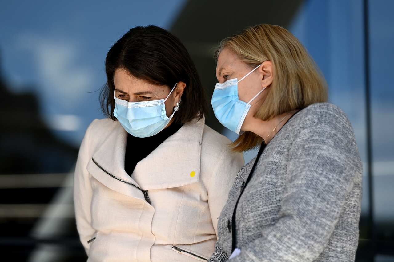 NSW Premier Gladys Berejiklian speaks to NSW Chief Health Officer Dr Kerry Chant during a COVID-19 press conference in Sydney.