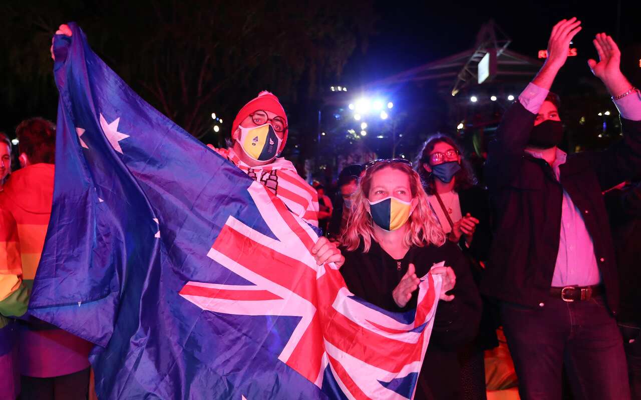 People celebrate in Brisbane following a vote announcement on Brisbane's successful 2032 Summer Olympics bid